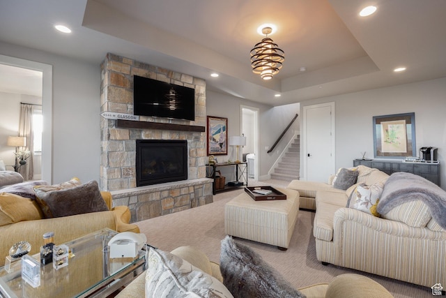 1136 E Black Hawk Way, Hideout, UT 84036 - carpeted living room with a tray ceiling, a stone fireplace, stairway, and recessed lighting