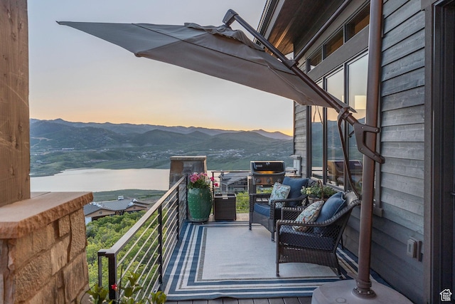 1136 E Black Hawk Way, Hideout, UT 84036 - balcony at dusk featuring a mountain view