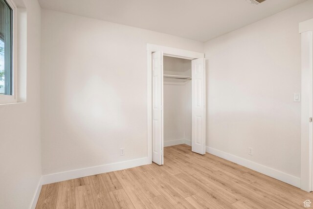 1098 N 1900 W, St George, UT 84770 - unfurnished bedroom featuring light wood-type flooring, baseboards, and a closet