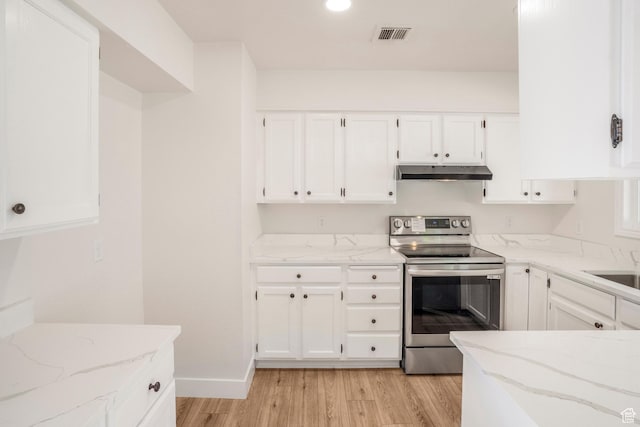 1098 N 1900 W, St George, UT 84770 - kitchen featuring stainless steel electric stove, under cabinet range hood, light wood-style floors, light stone countertops, and white cabinets