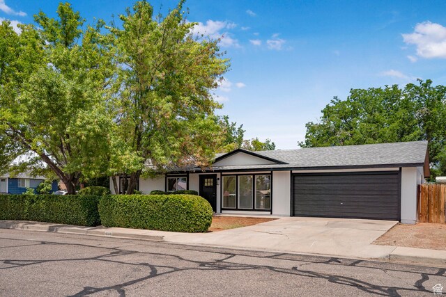 1098 N 1900 W, St George, UT 84770 - single story home with an attached garage, concrete driveway, and roof with shingles