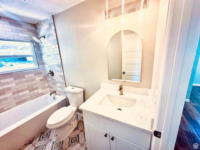 231 S 100th Ave E Unit 231, Willard, UT 84340 - bathroom with toilet, vanity, a textured ceiling, and tub / shower combination