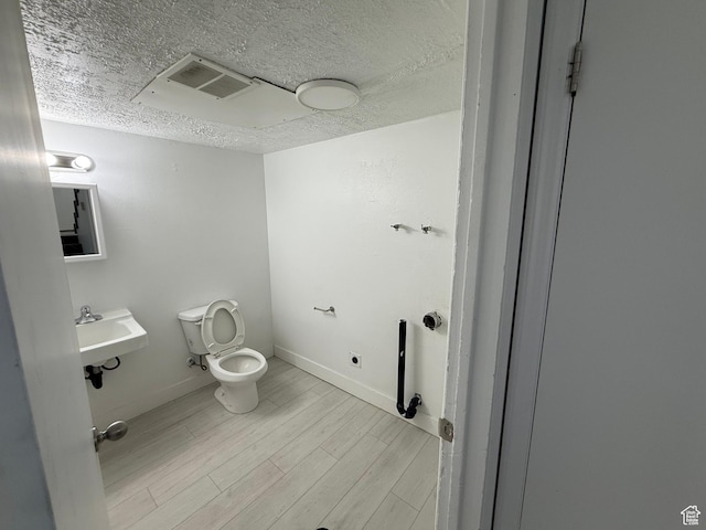 1071 N 150 W, Orem, UT 84057 - bathroom with wood finished floors and a textured ceiling