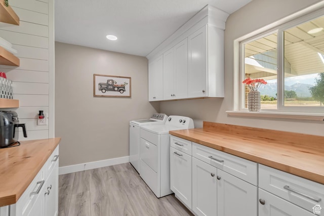 719 E Center St, Genola, UT 84655 - laundry area featuring washer and clothes dryer, cabinet space, light wood finished floors, baseboards, and recessed lighting