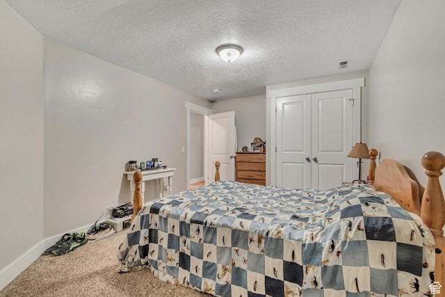 719 E Center St, Genola, UT 84655 - carpeted bedroom featuring a closet, baseboards, and a textured ceiling