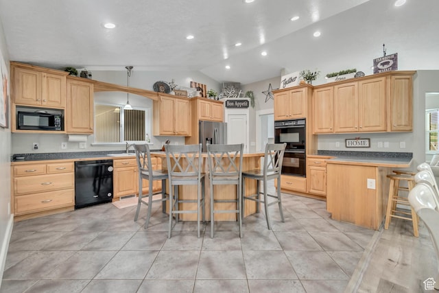719 E Center St, Genola, UT 84655 - kitchen featuring black appliances, lofted ceiling, a kitchen bar, light brown cabinetry, and recessed lighting