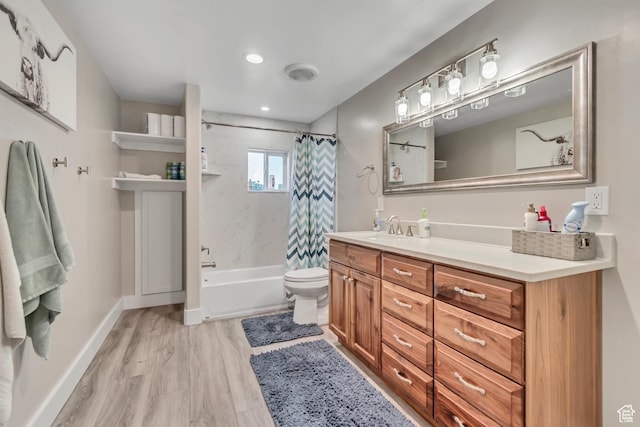 719 E Center St, Genola, UT 84655 - bathroom with vanity, shower / bathtub combination with curtain, toilet, wood finished floors, and recessed lighting