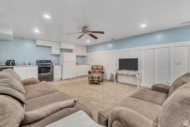 719 E Center St, Genola, UT 84655 - living area featuring a decorative wall, ceiling fan, recessed lighting, and a wainscoted wall