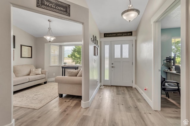 719 E Center St, Genola, UT 84655 - entrance foyer featuring light wood-style flooring, baseboards, and healthy amount of natural light