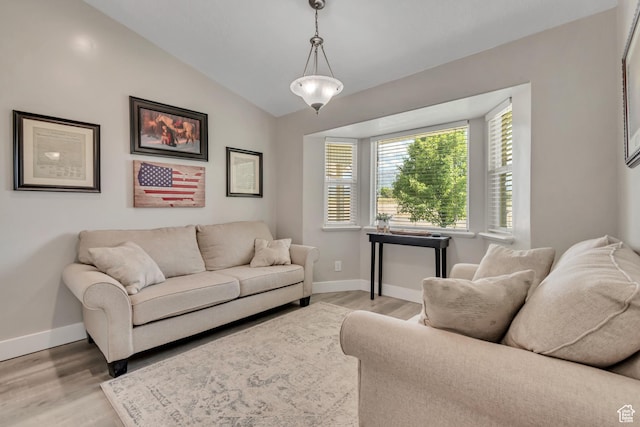 719 E Center St, Genola, UT 84655 - living room with light wood-style flooring, baseboards, and lofted ceiling