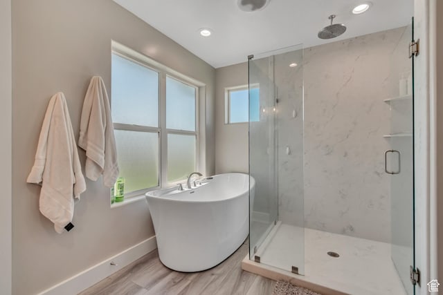719 E Center St, Genola, UT 84655 - full bath with a marble finish shower, baseboards, a freestanding tub, and wood finished floors