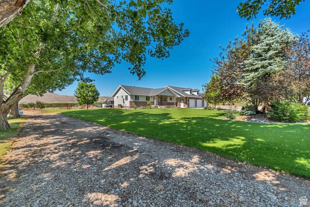 719 E Center St, Genola, UT 84655 - view of front of home featuring a front yard
