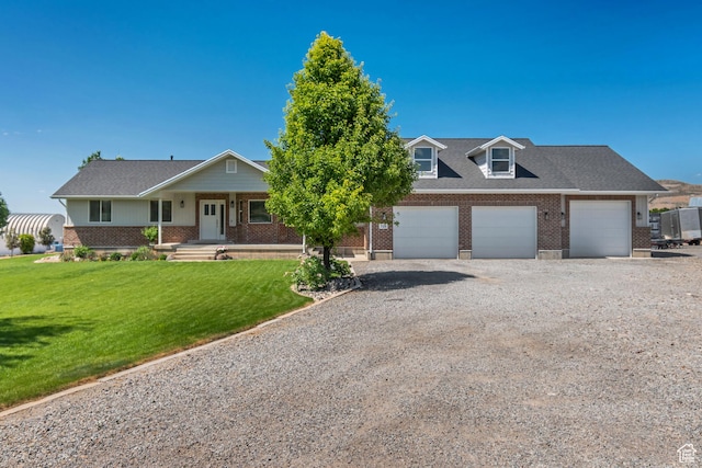 719 E Center St, Genola, UT 84655 - view of front facade with brick siding, covered porch, gravel driveway, and a front yard
