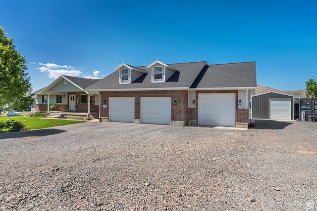 719 E Center St, Genola, UT 84655 - townhome / multi-family property with brick siding, covered porch, roof with shingles, and an attached garage