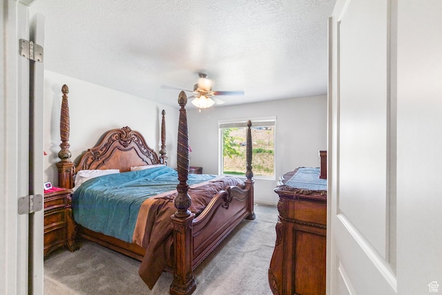 1788 S Longview Rd Unit 161, Santaquin, UT 84655 - bedroom with light carpet, a ceiling fan, and a textured ceiling