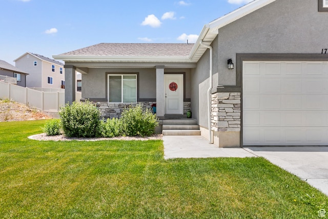 1788 S Longview Rd Unit 161, Santaquin, UT 84655 - view of front of house featuring stone siding, stucco siding, a front lawn, and an attached garage
