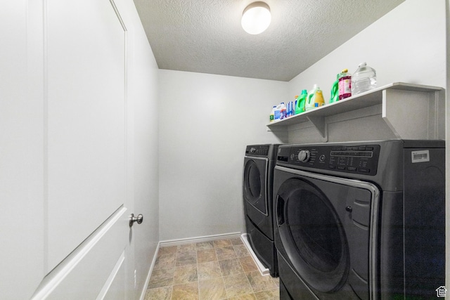 1788 S Longview Rd Unit 161, Santaquin, UT 84655 - laundry room with washer and clothes dryer, baseboards, and a textured ceiling
