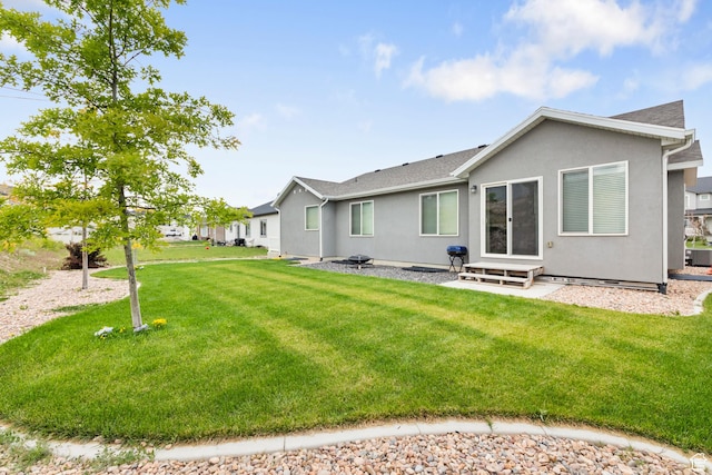 1788 S Longview Rd Unit 161, Santaquin, UT 84655 - rear view of property featuring entry steps, stucco siding, and a yard