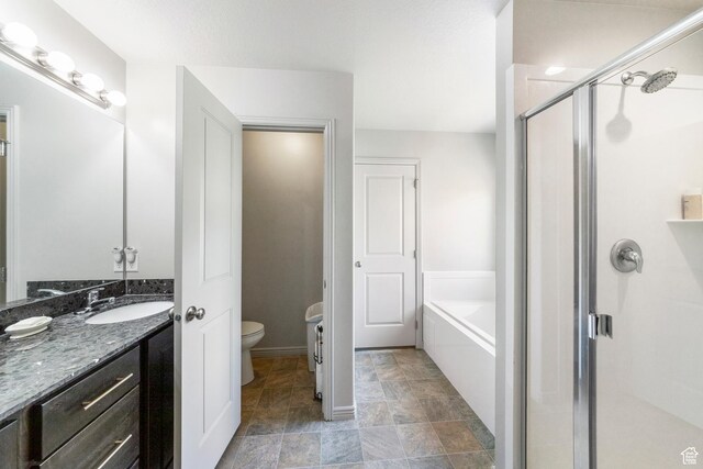 1788 S Longview Rd Unit 161, Santaquin, UT 84655 - bathroom featuring a stall shower, a bath, toilet, and vanity