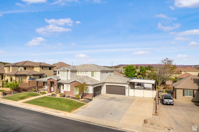 2699 S 2000 E, St George, UT 84790 - view of front of property featuring a residential view, a garage, driveway, and stucco siding