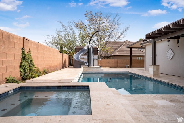 2699 S 2000 E, St George, UT 84790 - view of swimming pool featuring an in-ground hot tub, a water slide, and a fenced backyard
