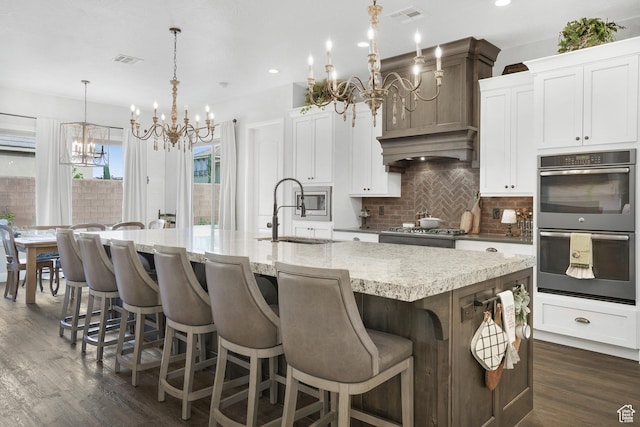 2699 S 2000 E, St George, UT 84790 - kitchen featuring a chandelier, a sink, appliances with stainless steel finishes, tasteful backsplash, and dark wood-style floors