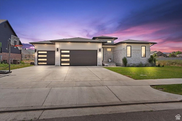 407 W 275 N, Morgan, UT 84050 - view of front of property featuring an attached garage, a front yard, concrete driveway, cooling unit, and stucco siding