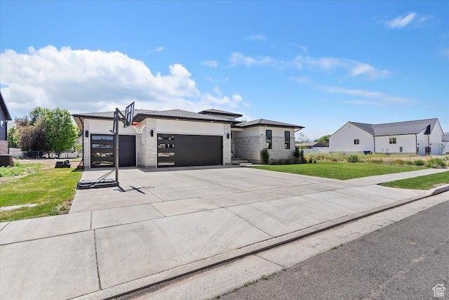 407 W 275 N, Morgan, UT 84050 - view of front of house with a garage, concrete driveway, a front yard, and central air condition unit