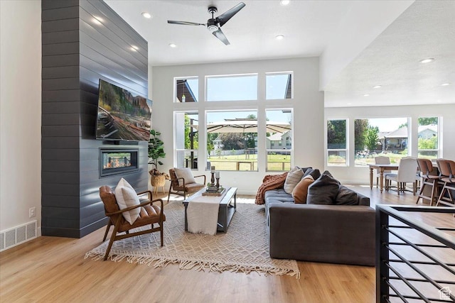 407 W 275 N, Morgan, UT 84050 - living area with a fireplace, wood finished floors, recessed lighting, and ceiling fan
