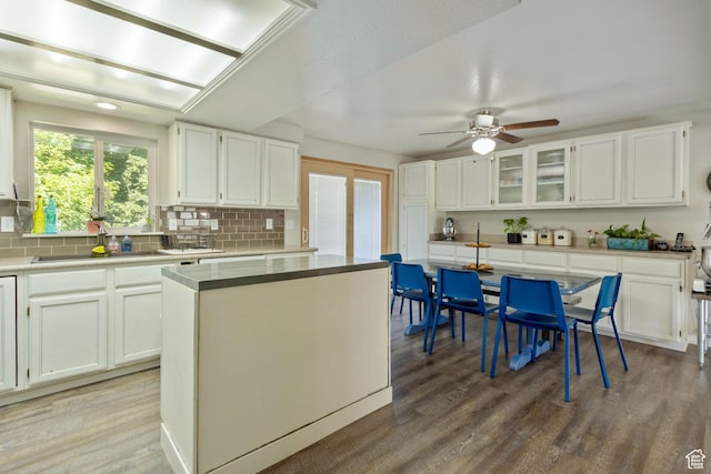 408 E 850 N, Brigham City, UT 84302 - kitchen featuring a sink, backsplash, a ceiling fan, and wood finished floors