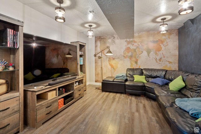 408 E 850 N, Brigham City, UT 84302 - living area with a textured ceiling, wood finished floors, and baseboards