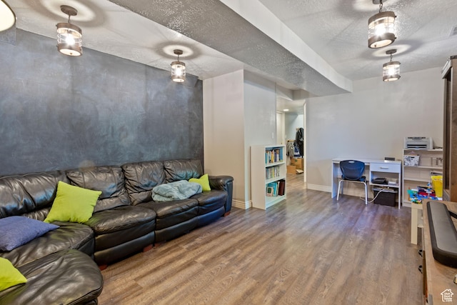 408 E 850 N, Brigham City, UT 84302 - living area featuring wood finished floors, a textured ceiling, and baseboards