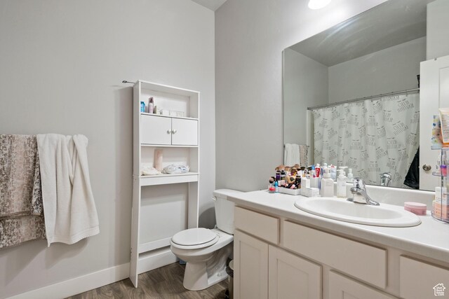633 N Sun Peak Dr, Vineyard, UT 84059 - bathroom featuring vanity, toilet, wood finished floors, and a shower with curtain