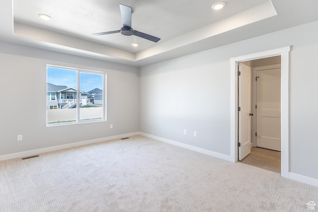 3087 N 2875 W Unit 4, Plain City, UT 84404 - spare room with a tray ceiling, light colored carpet, a ceiling fan, and recessed lighting