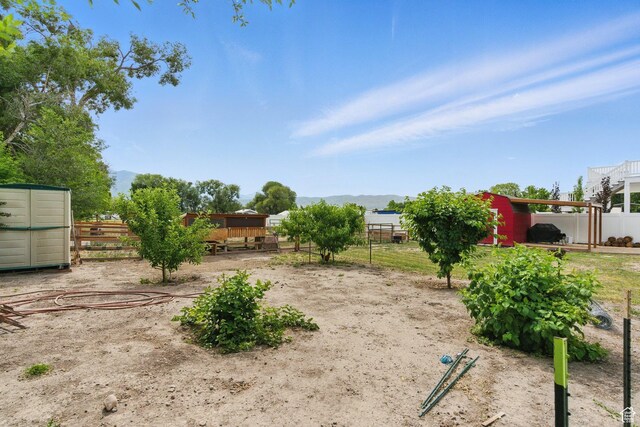 12345 S Redwood Rd, Riverton, UT 84065 - view of yard featuring an outbuilding