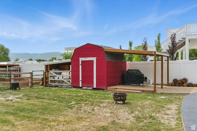 12345 S Redwood Rd, Riverton, UT 84065 - view of shed with a fire pit and a mountain view