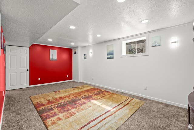 12345 S Redwood Rd, Riverton, UT 84065 - finished below grade area featuring carpet floors, a textured ceiling, recessed lighting, and baseboards