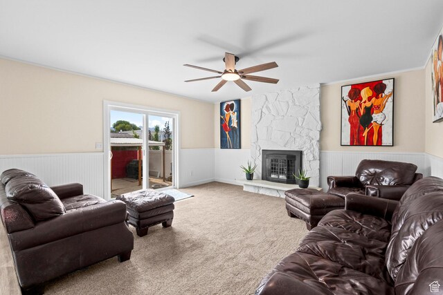 12345 S Redwood Rd, Riverton, UT 84065 - carpeted living room with a ceiling fan, wainscoting, and a fireplace