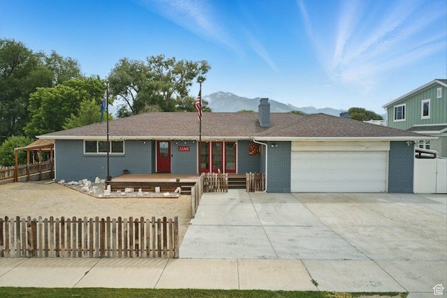 12345 S Redwood Rd, Riverton, UT 84065 - single story home featuring a garage, a chimney, brick siding, and concrete driveway