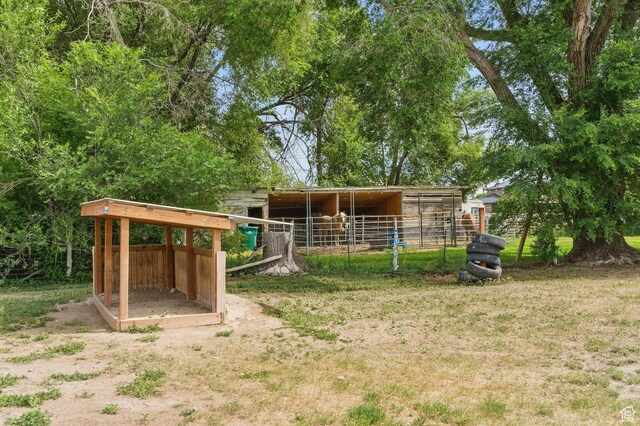 12345 S Redwood Rd, Riverton, UT 84065 - back of property featuring an exterior structure and an outdoor structure