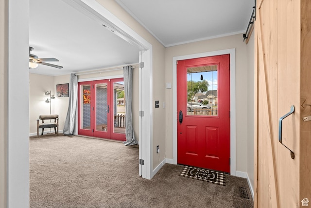 12345 S Redwood Rd, Riverton, UT 84065 - carpeted entrance foyer with baseboards, plenty of natural light, crown molding, a barn door, and a ceiling fan