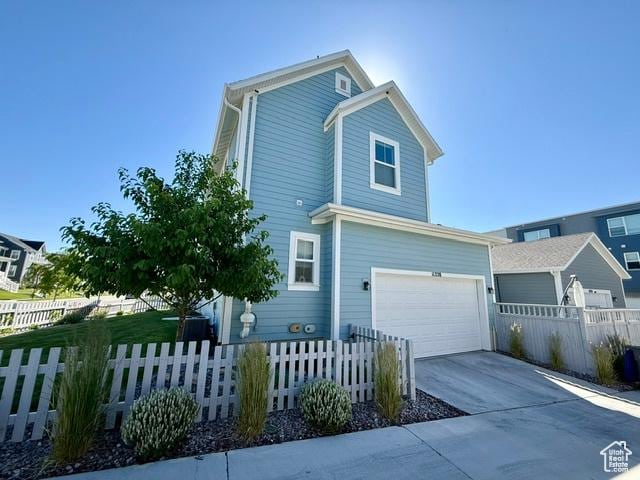 11228 S Old Bridge Rd W, South Jordan, UT 84009 - view of home's exterior featuring a garage and concrete driveway