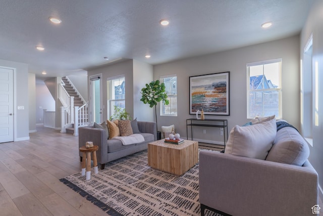 11228 S Old Bridge Rd W, South Jordan, UT 84009 - living area with stairway, light wood-style floors, recessed lighting, and baseboards