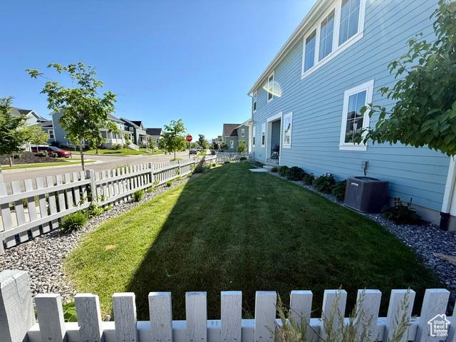 11228 S Old Bridge Rd W, South Jordan, UT 84009 - view of yard with central AC and a residential view