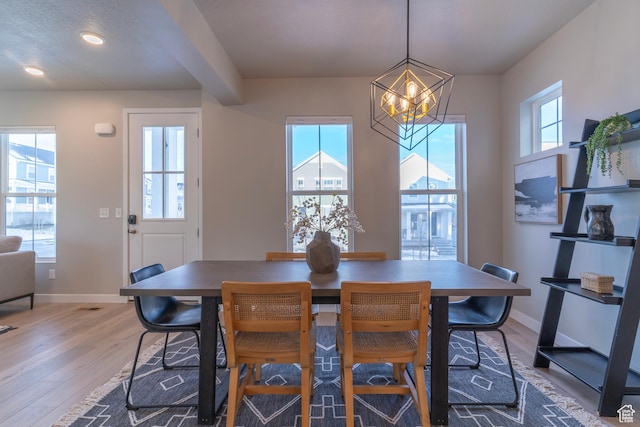 11228 S Old Bridge Rd W, South Jordan, UT 84009 - dining room with a chandelier, plenty of natural light, light wood-style flooring, and recessed lighting