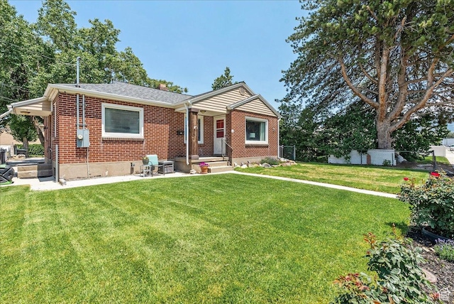 6 W Miller St S, Salt Lake City, UT 84107 - view of front facade with brick siding and a patio area