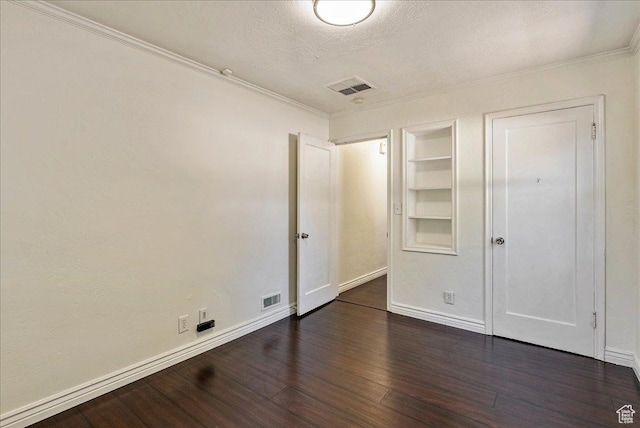 6 W Miller St S, Salt Lake City, UT 84107 - unfurnished bedroom featuring dark wood-type flooring, crown molding, and a textured ceiling