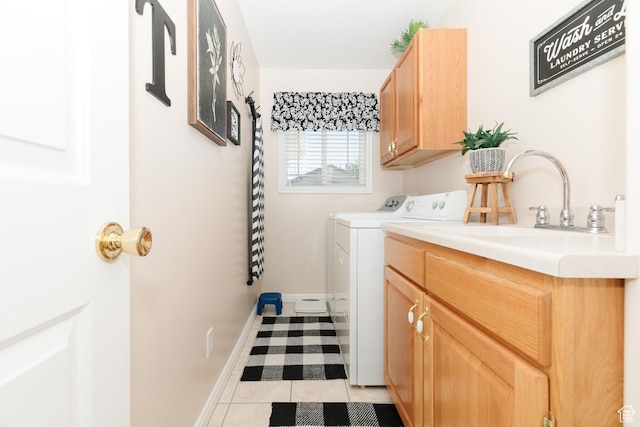 831 S 1150 E, Preston, ID 83263 - laundry area featuring washer and clothes dryer, cabinet space, light tile patterned floors, and baseboards