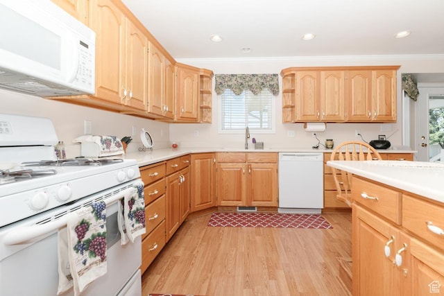 831 S 1150 E, Preston, ID 83263 - kitchen featuring white appliances, light wood-type flooring, light countertops, a sink, and ornamental molding
