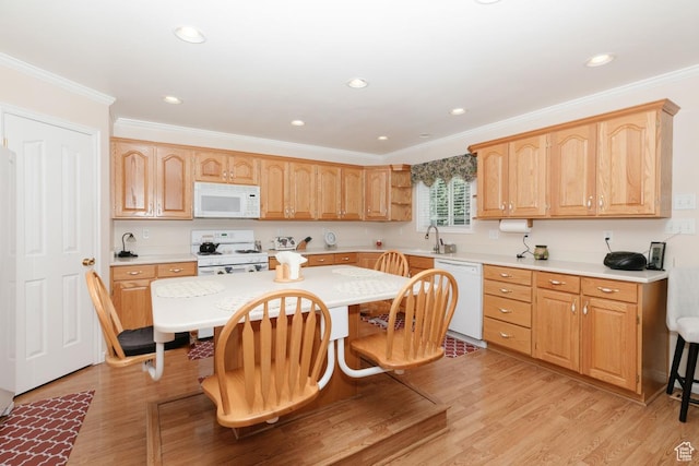 831 S 1150 E, Preston, ID 83263 - kitchen with white appliances, a kitchen bar, a sink, light countertops, and crown molding